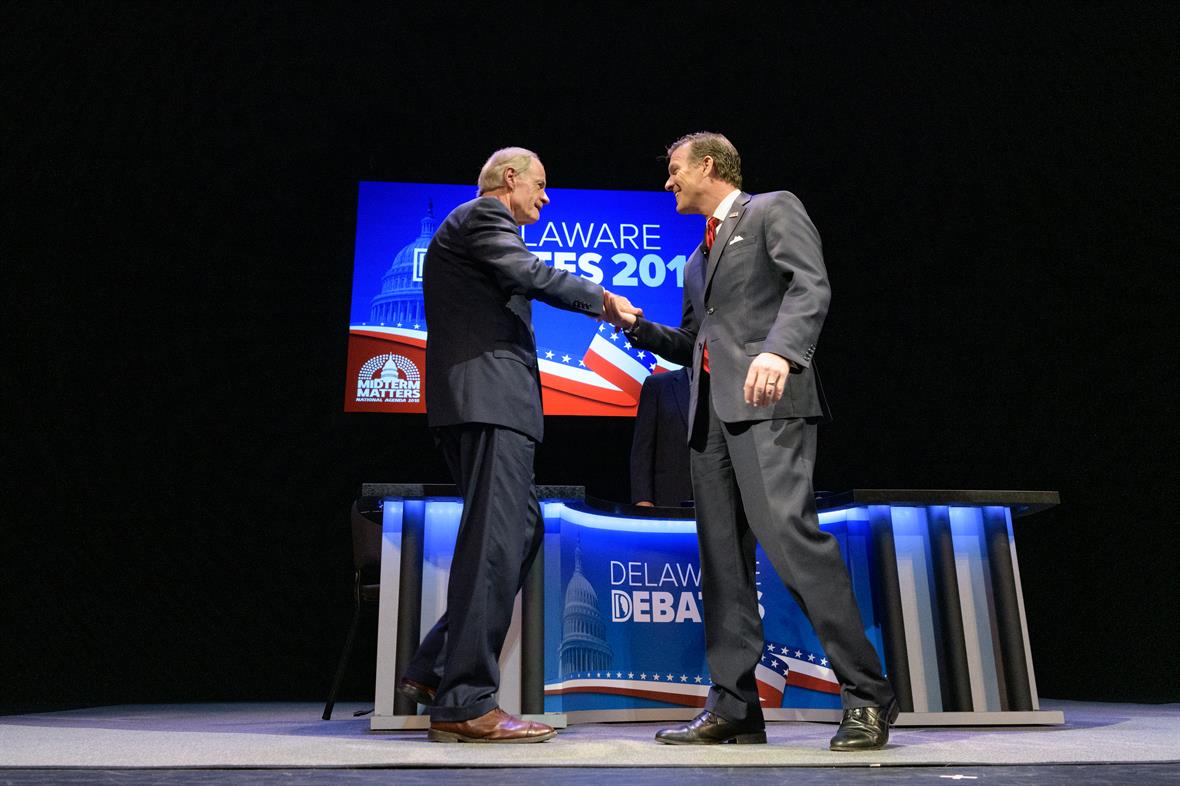 The U.S. Senate candidates, incumbent Tom Carper and challenger Rob Arlett, shake hands before their debate on October 17, 2018.