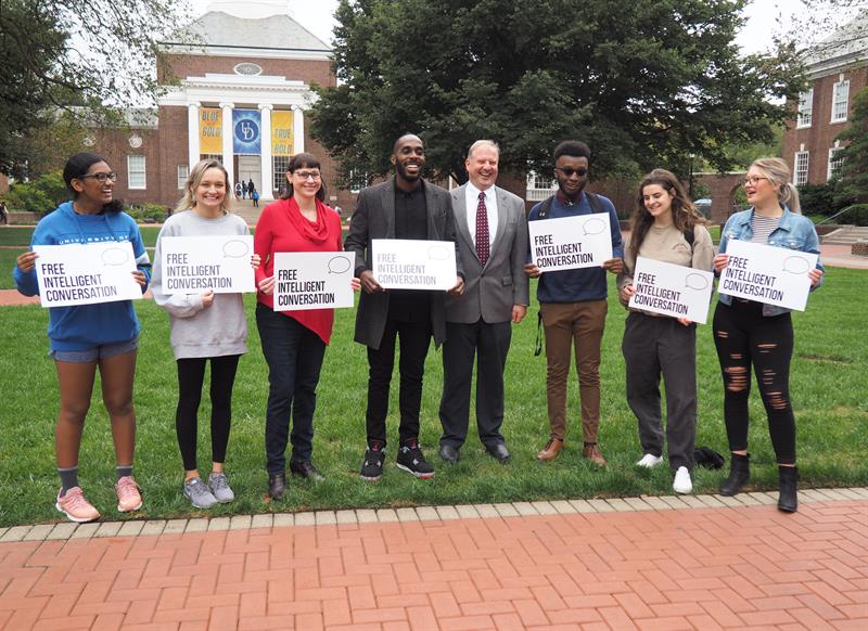 Kyle Emile (center left, wearing black shirt), founder of the national Free Intelligent Conversation initiative, visited with College of Arts and Sciences Dean John A. Pelesko (center right), UD Communication Professor Lindsay Hoffman, Ph.D. (left of Emile), and University of Delaware students during a visit to UD in October 2019.