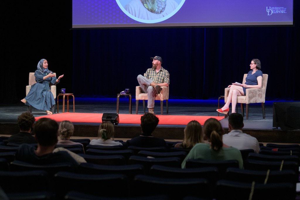 Asma Khalid (left) and David Joy (center) discussed the current political climate with National Agenda Director Lindsay Hoffman at the University of Delaware's Mitchell Hall Auditorium in Newark, Delaware.