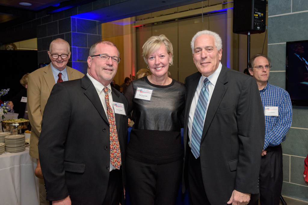 Founders of the CPC's Wainwright scholarship, Joan Wainwright (AS '82), center, and her husband Jerome LeBlond (AS '94), left, helped celebrate Ralph Begleiter's retirement on November 18, 2016.