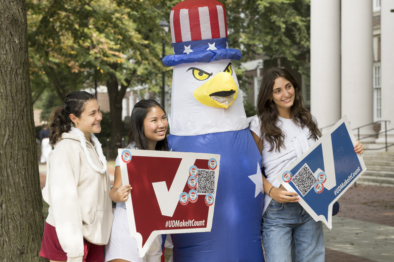 3 students participating in National Voter Registration Day